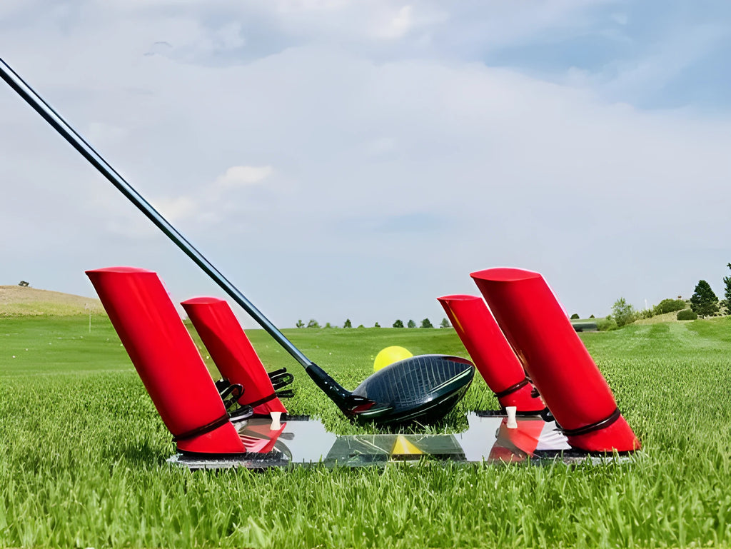 Transparent golf swing mirror on grass for putting practice with storage bag nearby
