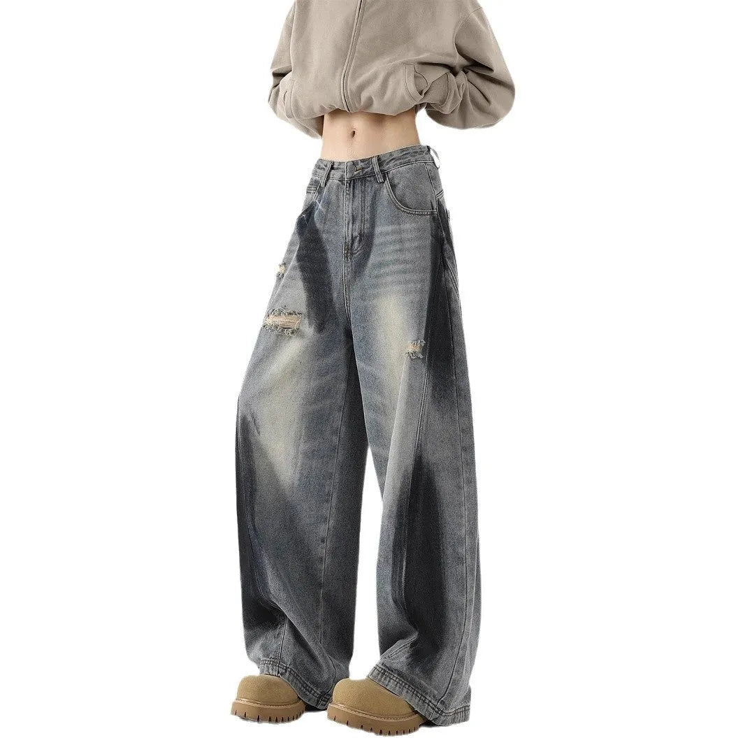 Men's blue distressed jeans with splash-ink patterns and rips in loose fit American style