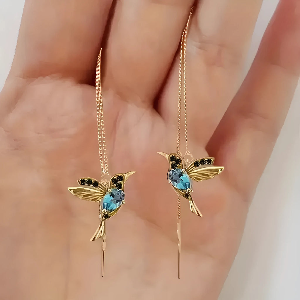 Women's long hanging earrings with bird motif in red, blue, or red lvzuan electroplated alloy.