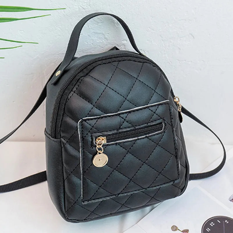 Girls' hard structured backpack with embroidery in white, black, or pink colours, showing front view and soft handle.