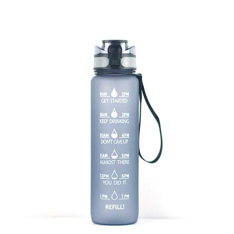 Transparent 1000ml sports water bottle with fruit infuser showing BPA-free Tritan construction