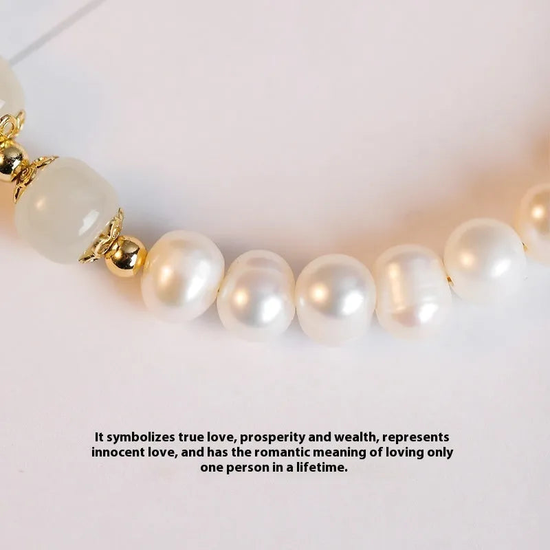 Korean style diamond-shaped freshwater pearl bracelet in Hetian jade colour on a white background.