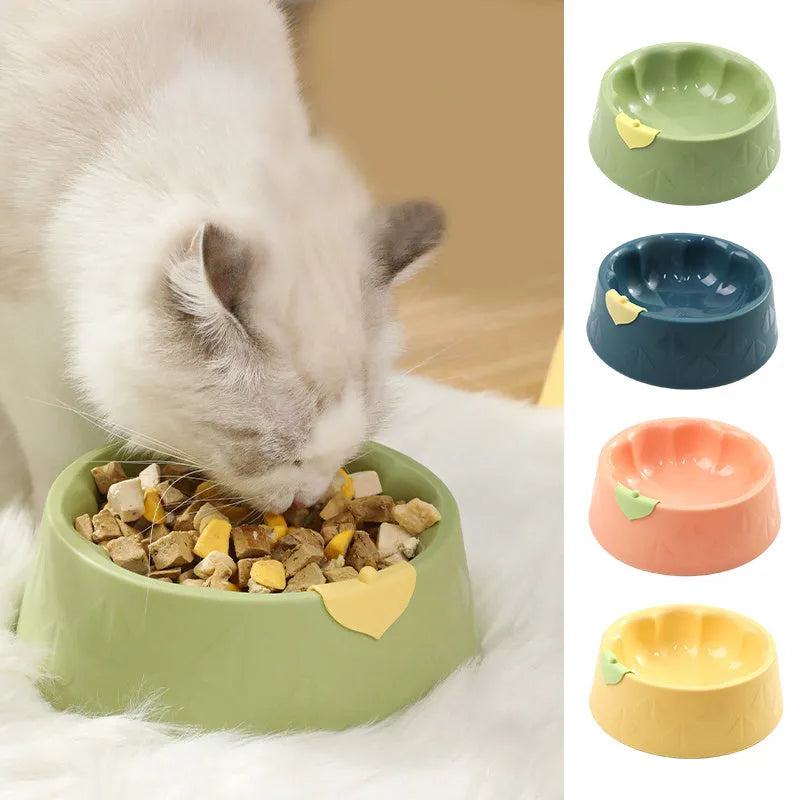 Green plastic double pet bowl with flower-shaped design and anti-tip base for cats and small dogs.
