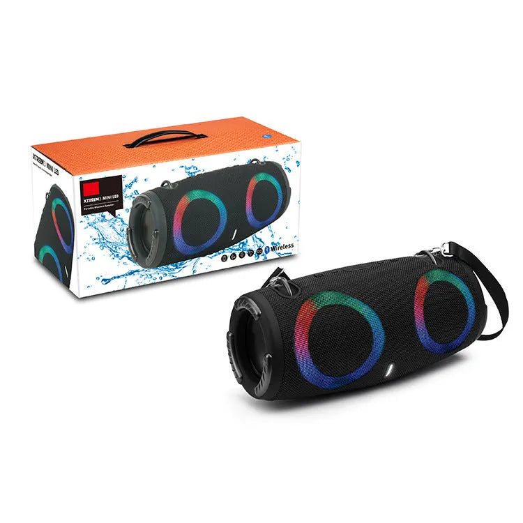 War Drum portable Bluetooth speaker with coloured LED lights in a black finish, showing carrying strap and control buttons.