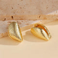 Gold geometric shell thread clip-on earrings on woman, beach ocean vacation style, zinc alloy electroplated ear clips