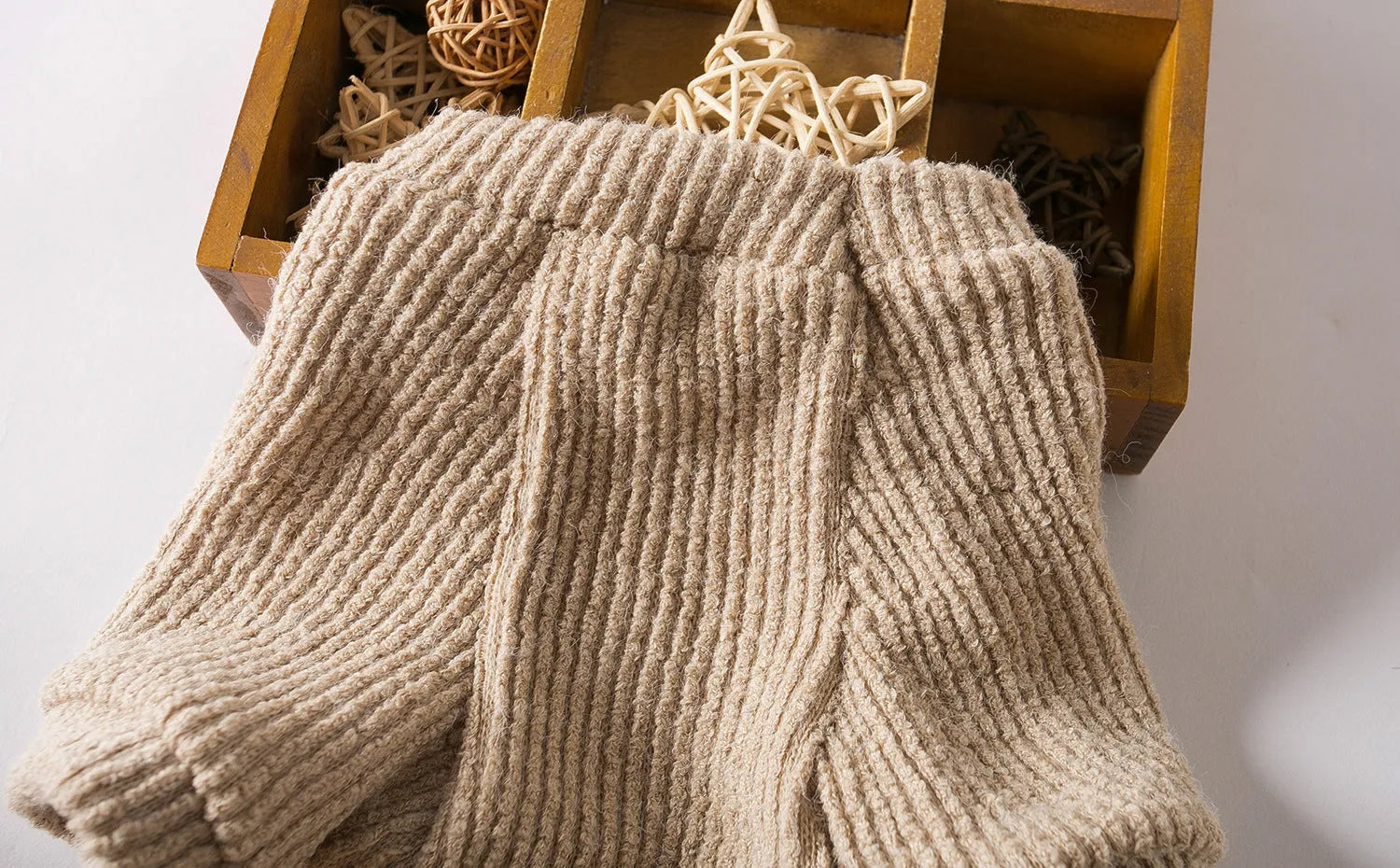 Brown cloth dog sweater pullover on a small breed dog.
