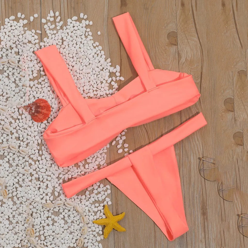 Solid colour split bikini swimsuit in orange with nylon outer and polyester lining, sizes S M L