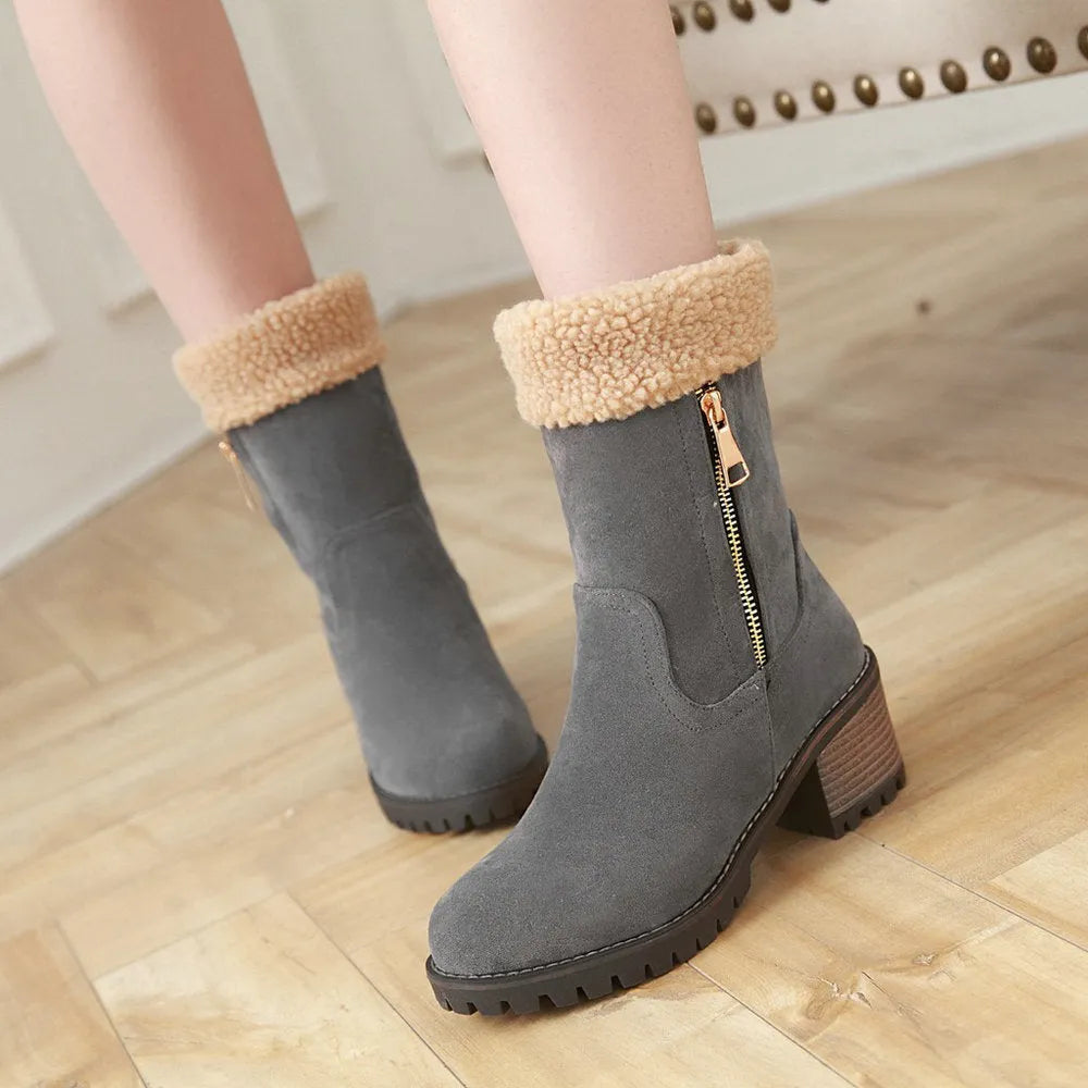 Black waterproof rubber snow boots with a thick sole and plush lining.