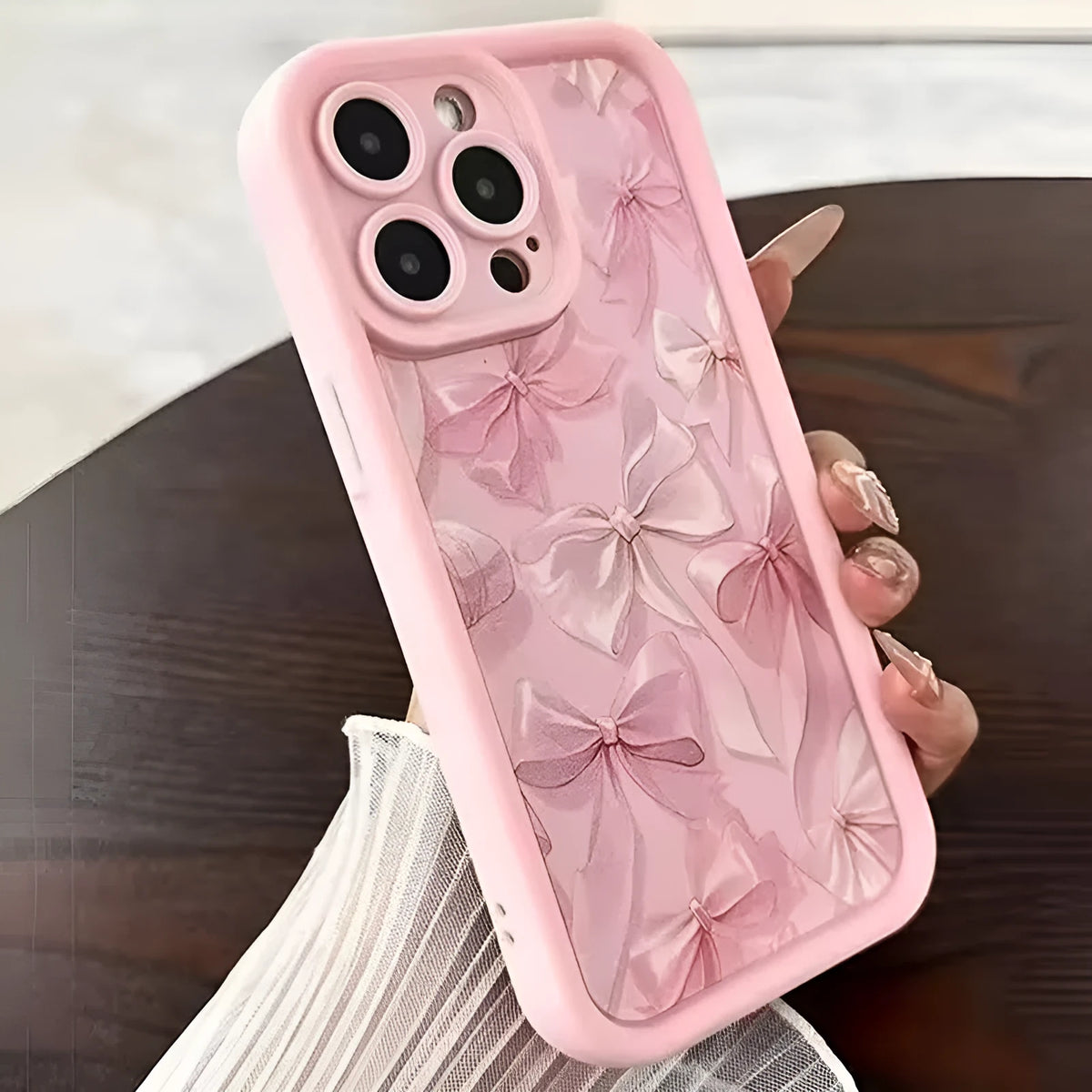 Pink silicone phone case with custom Tianyan ladder pattern and bow detail, compatible with Apple iPhone models