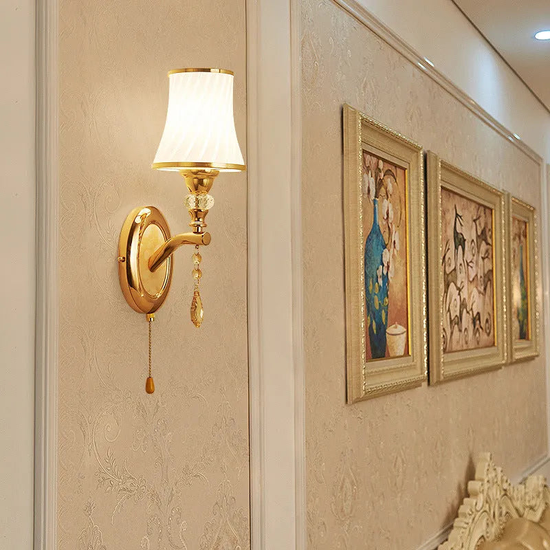 European-style glass wall lamp mounted on a wall, shown in a single head configuration.