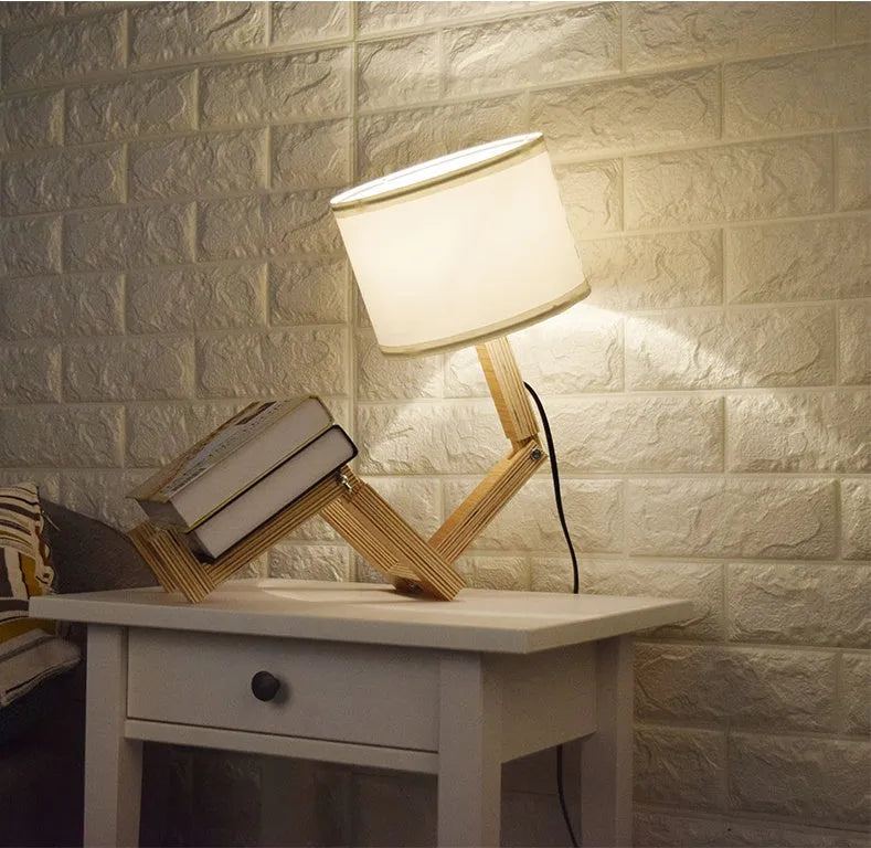 Creative wooden humanoid table lamp with white fabric shade on desk, 22x44x16 cm, button switch