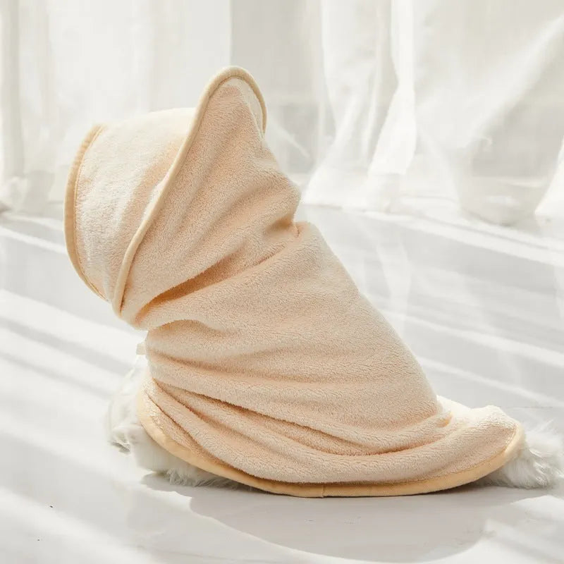 Microfiber pet quick-drying bathrobe in beige, folded on surface