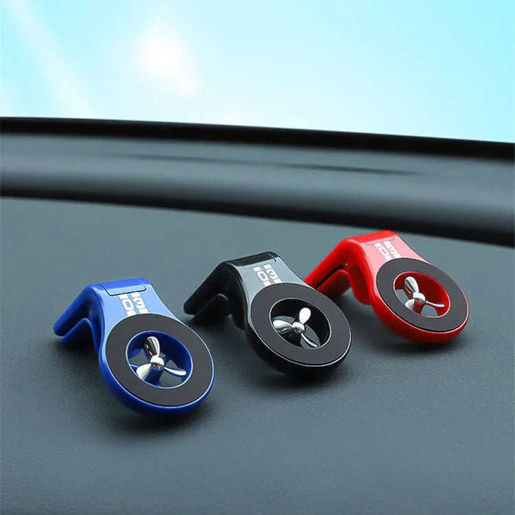 Magnetic car phone holder mounted on vehicle air vent with smartphone attached