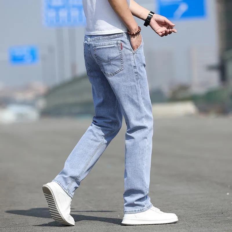 Men's straight leg jeans in smoky grey high elasticity fabric with zip fly closure