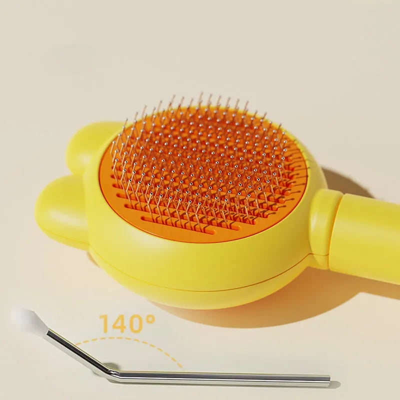 Self-cleaning pet grooming brush with release button in green, pink, purple or yellow colour options