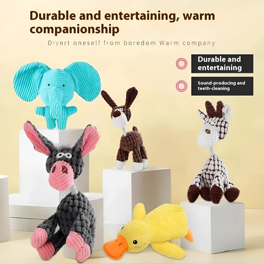 Assorted plush dog toys including a pink-gray donkey, a beige donkey, a blue elephant, and yellow ducks in three sizes.