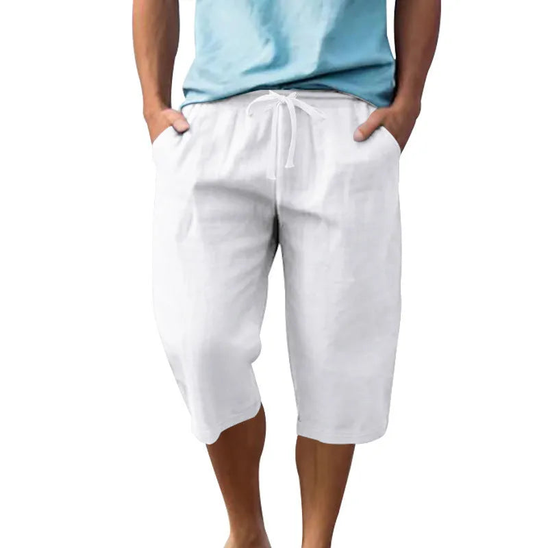 Men's solid colour linen shorts with a drawstring waist shown in a light blue shade.