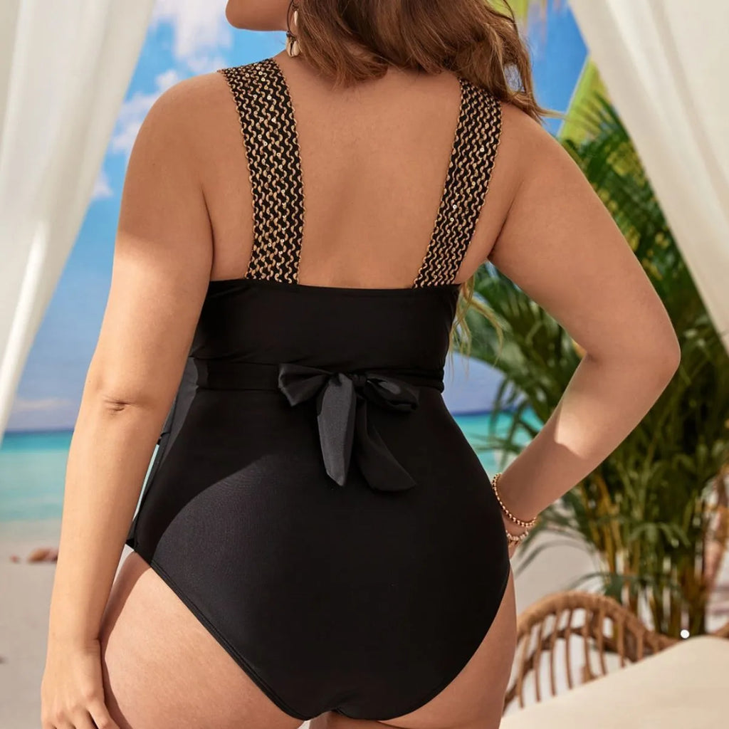 Women's black plus-size one-piece swimsuit with chest pads and sleeveless design