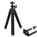 Black flexible octopus tripod with legs wrapped around a pole holding a smartphone