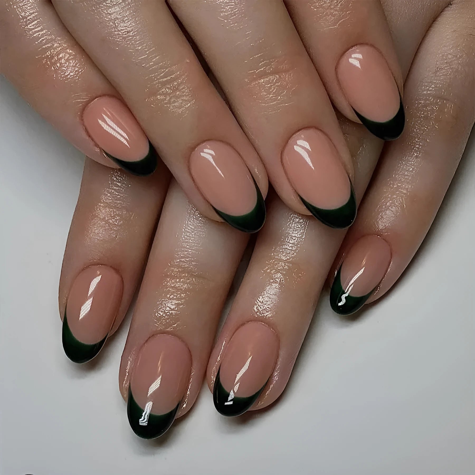24 black French style artificial nails with almond shaping in J049 colour