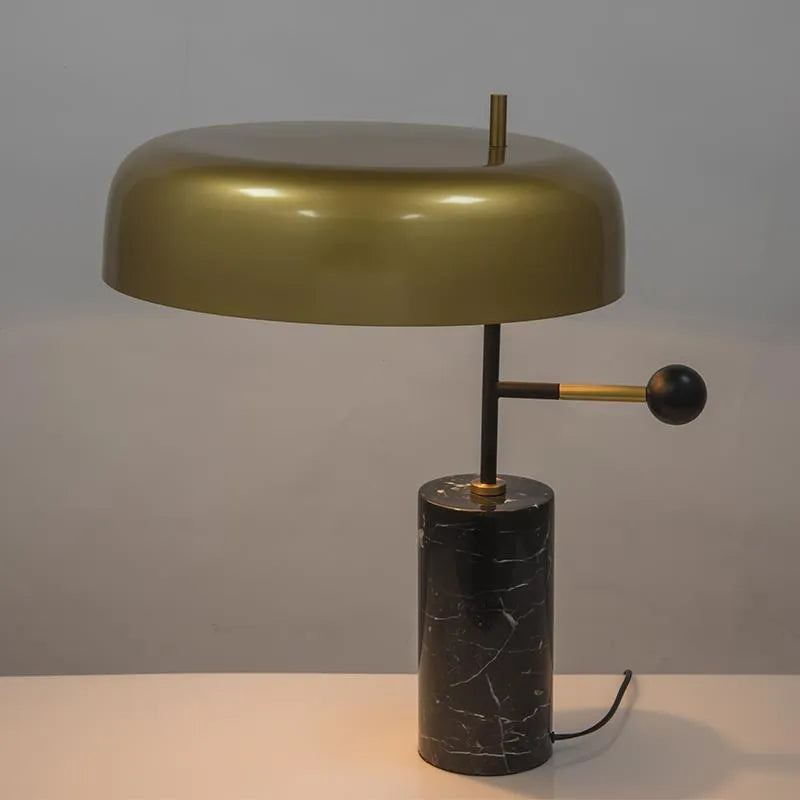 European-style bedside table lamp with warm white lighting on wooden surface