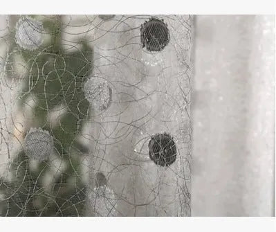 Blackout curtain panel showing light-blocking fabric, available in multiple widths with hook or rings for hanging.