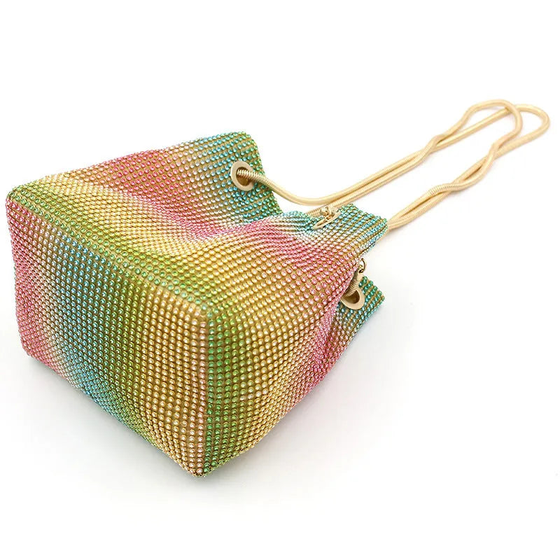Soft rainbow rhinestone bucket bag with adjustable strap, shown in multicoloured sparkle.