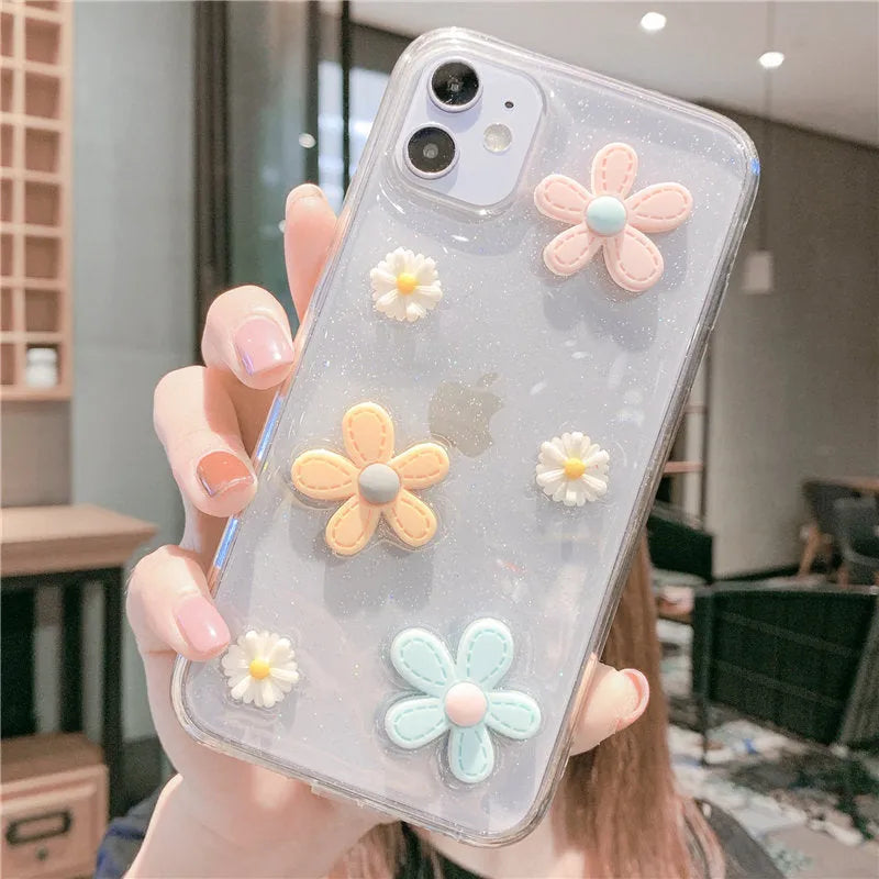 Soft rubber iPhone case with pink floral and girl heart pattern, shown fitted on a phone.