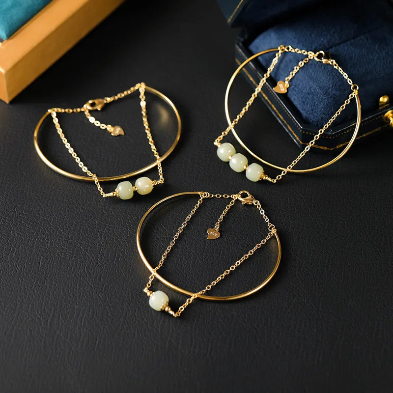 Women's Hetian jade bracelet with gold inlay design in single, double, or three-bead versions.