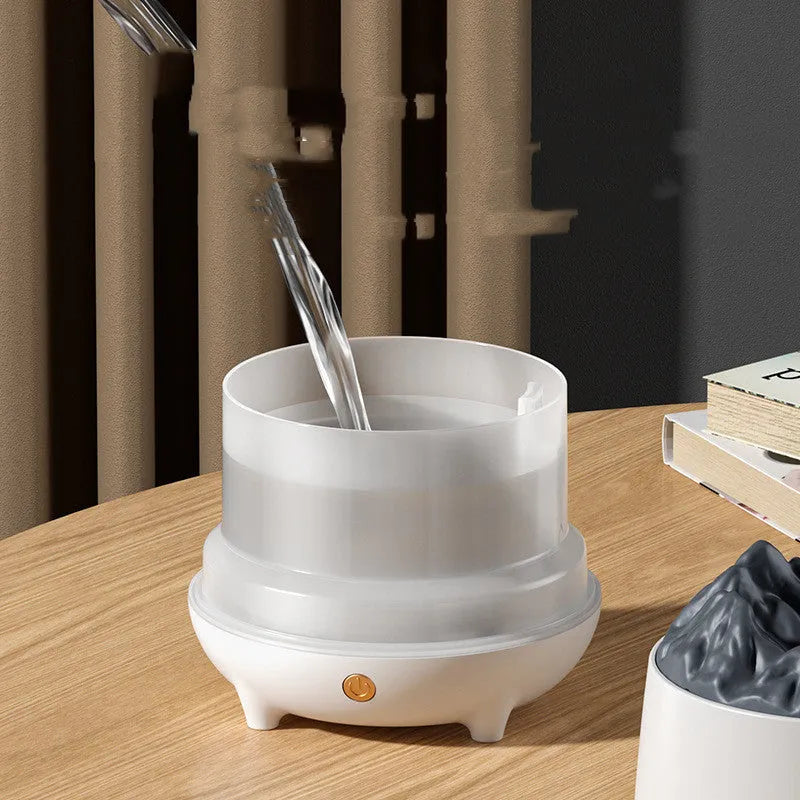 Black volcanic mountain-shaped ultrasonic humidifier with USB cable on wooden surface