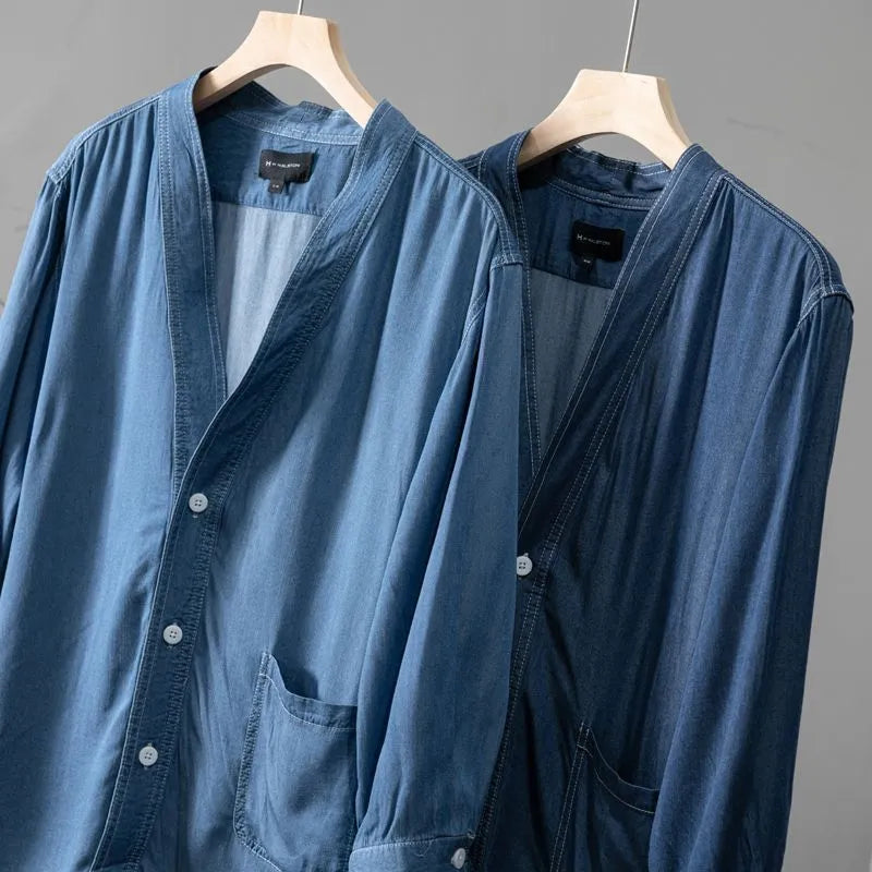 Men's dark blue casual denim coat with three-quarter sleeves and a V-neck collar.