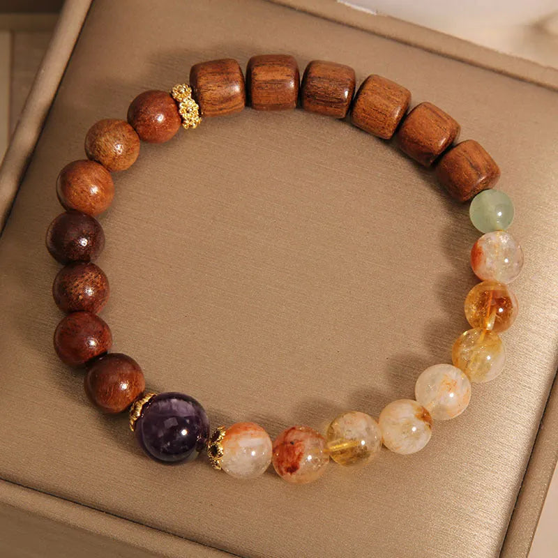 Women's bracelet in yellow tower crystal and amethyst tones with pearl and rhinestone decorative elements