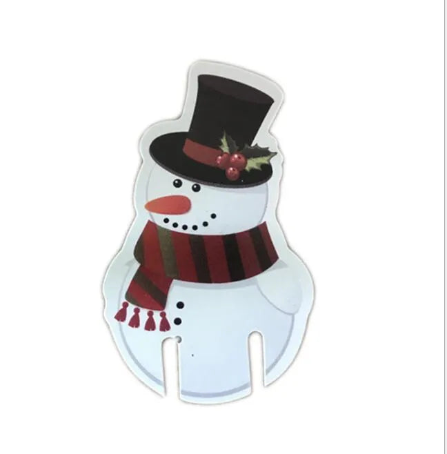 10 red paper Santa hat wine glass toppers on a Christmas table
