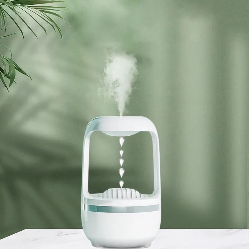 White anti-gravity humidifier showing water droplets flowing upwards, with USB cable and 500ml water tank.