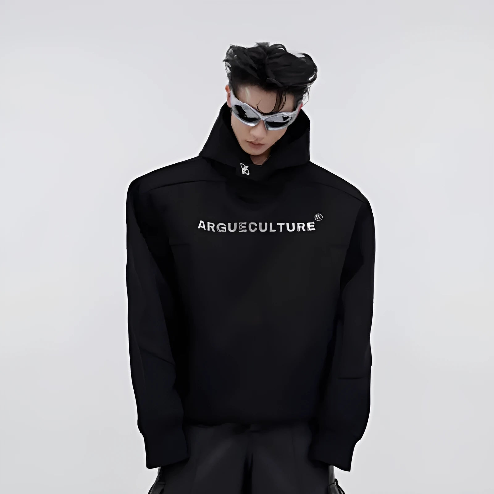 A red men's loose hooded sweater with heavy shoulder pads and a three-dimensional printed pattern.