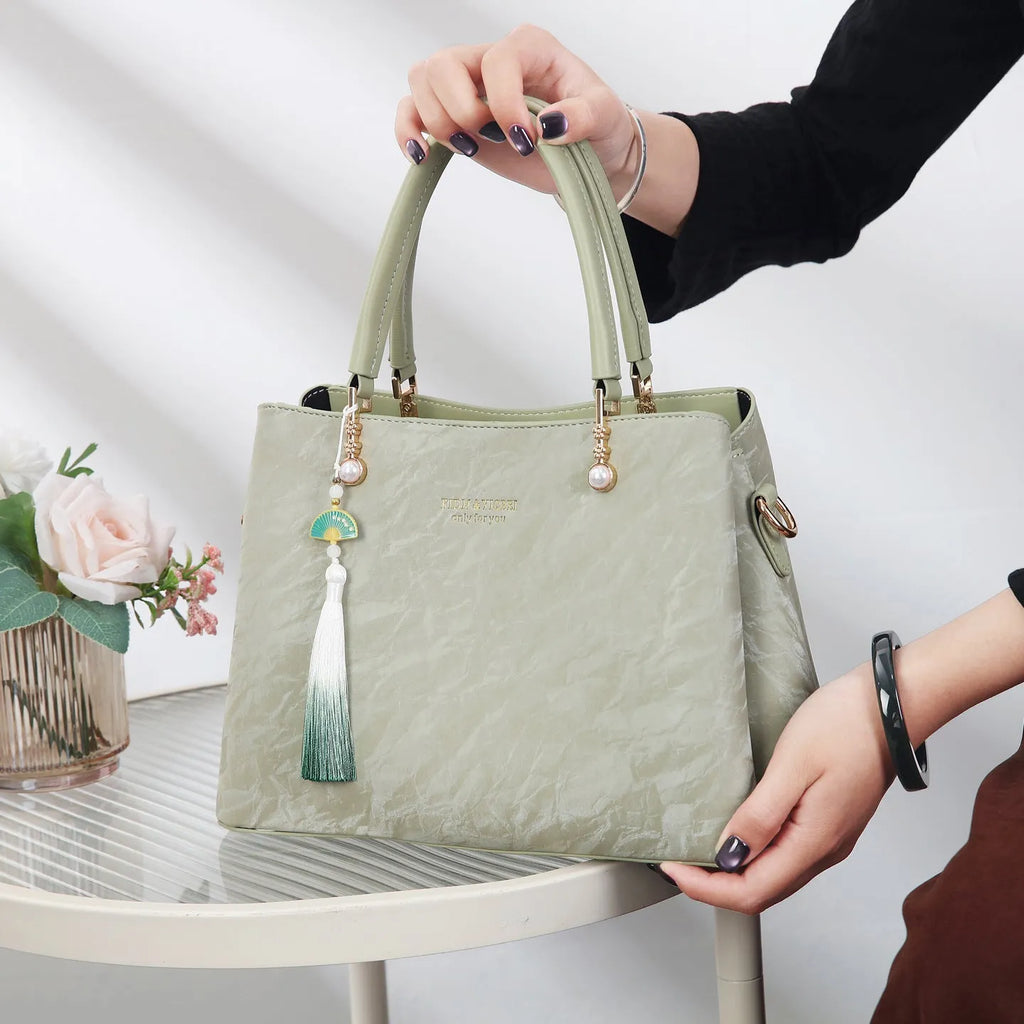 Women's PU leather shoulder bag with horizontal square shape and slit pockets in ethnic-style finish