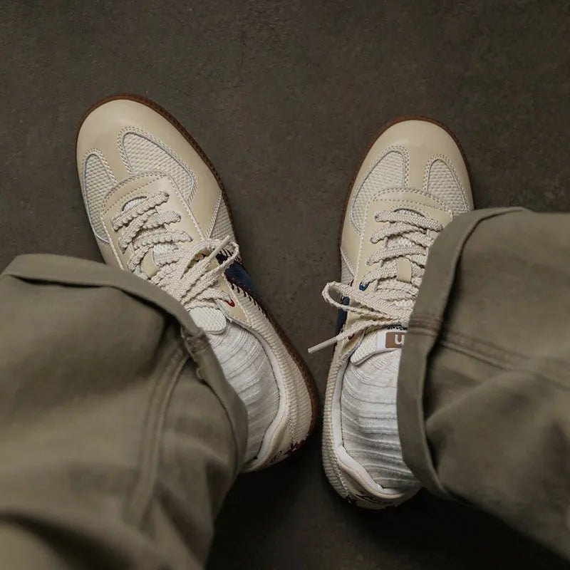 White mesh men's fashion casual exercise sneakers with flat heel on display
