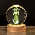 6cm white crystal ball desk ornament with laser-engraved cross design on a solid wood warm light base.