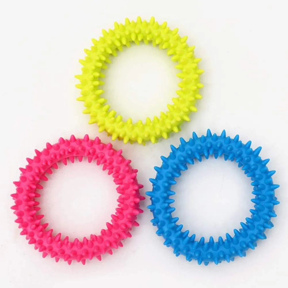 Blue TPR spiky ring dog chew toy for dental cleaning and bite training on a white background.