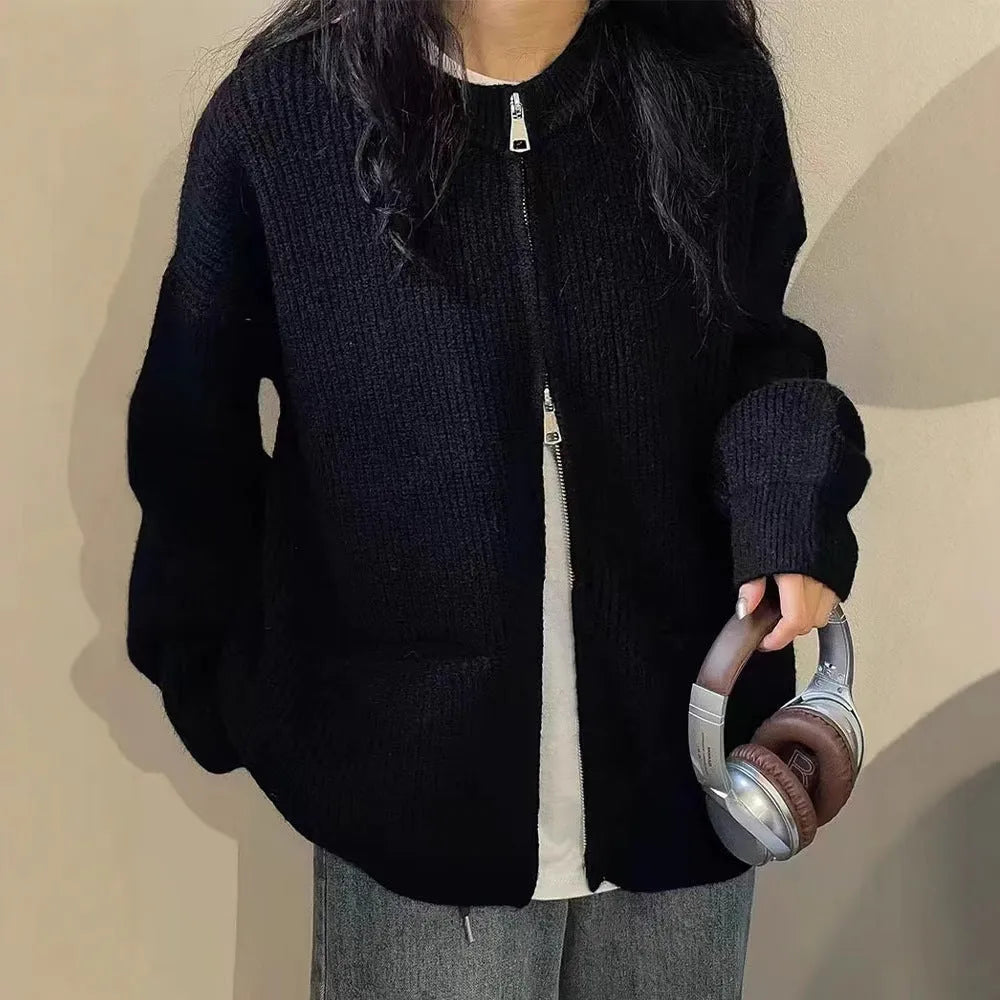 Beige temperature-sensitive viscose sweater coat, long sleeve cardigan style on a hanger.