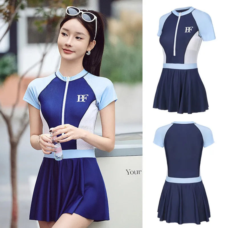 Conservative women's sports one-piece swimsuit in a colour-block pattern, shown in colour E92 or E93.