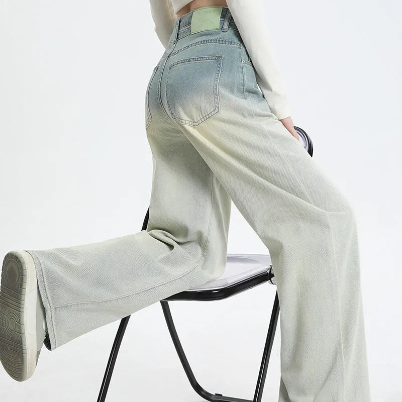 Women's gradient blue straight-leg wide-leg denim trousers laid flat.