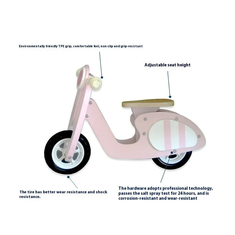 Pink wooden balance scooter for toddlers with a 10-inch non-slip deck.