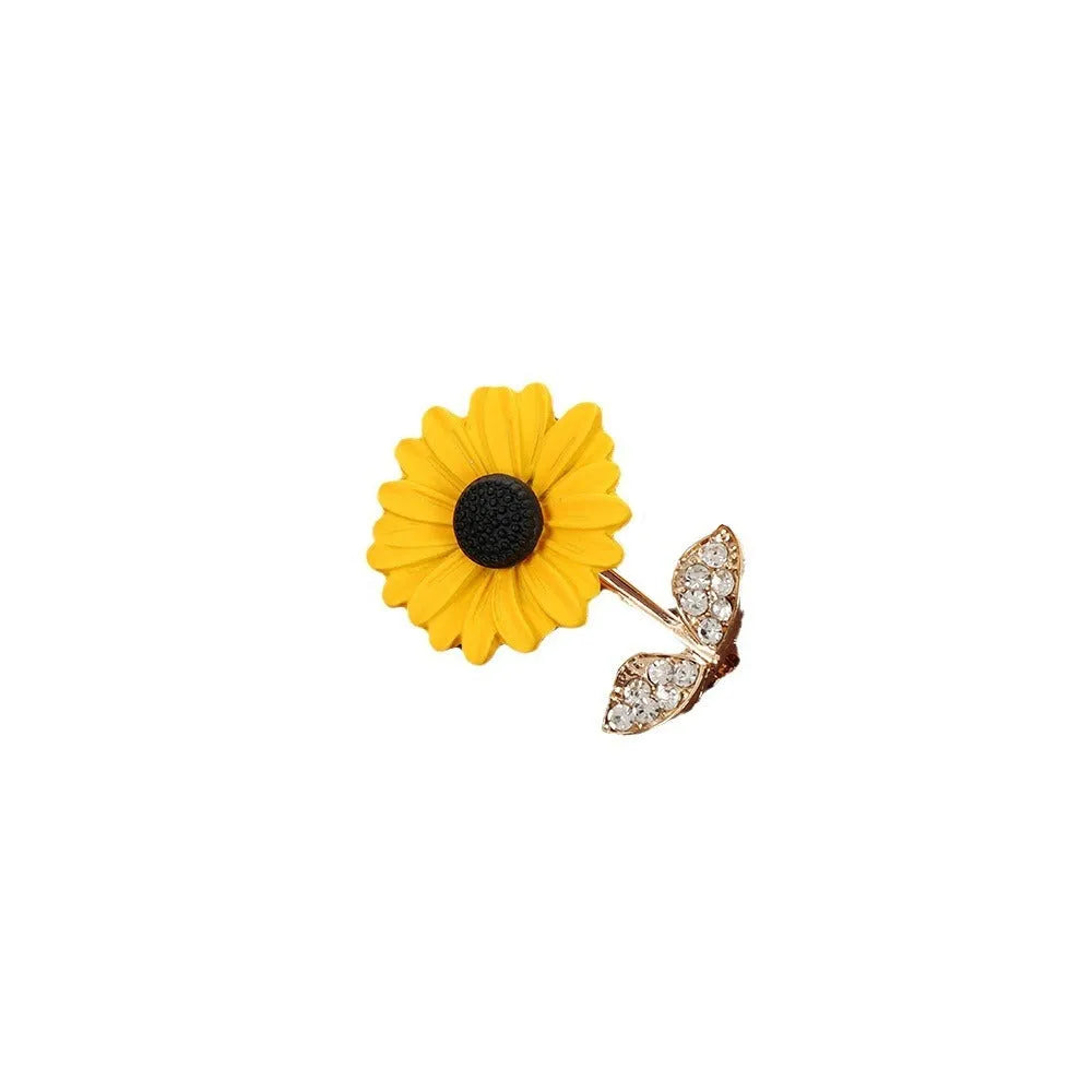 Close-up of a sunflower brooch pin for women, alloy electroplated finish, 2.4 cm by 3.1 cm size