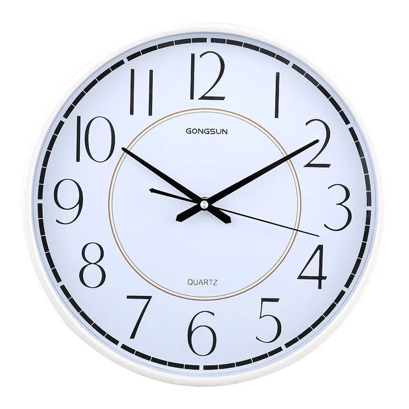 14-inch round wall clock with white face, black numbers, and sweep second movement on a light wall