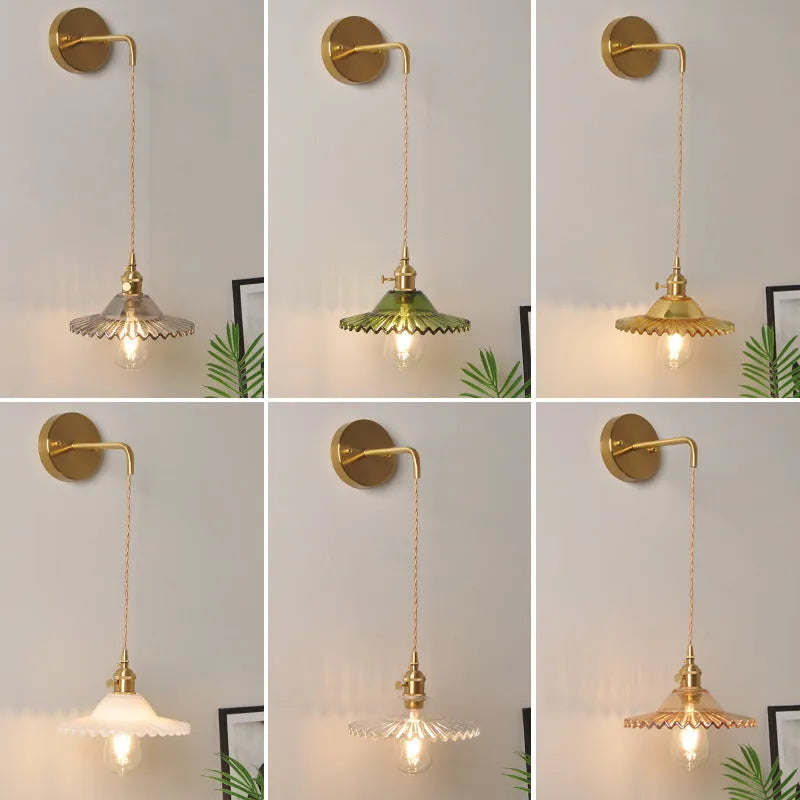 Retro brass lotus wall lamp with glass shade mounted on a wall, showing copper fittings.