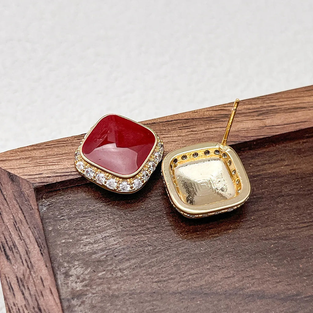 Retro red alloy earrings with geometric square inlaid design for women.