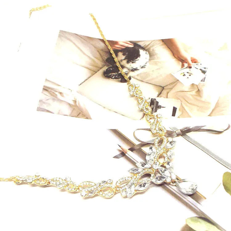 Gold alloy clavicle chain necklace with bow pendant on display