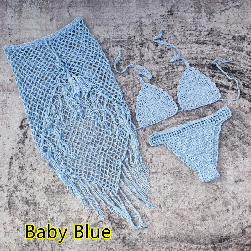 Women's white handmade crochet bikini swimsuit set with a separate matching skirt.