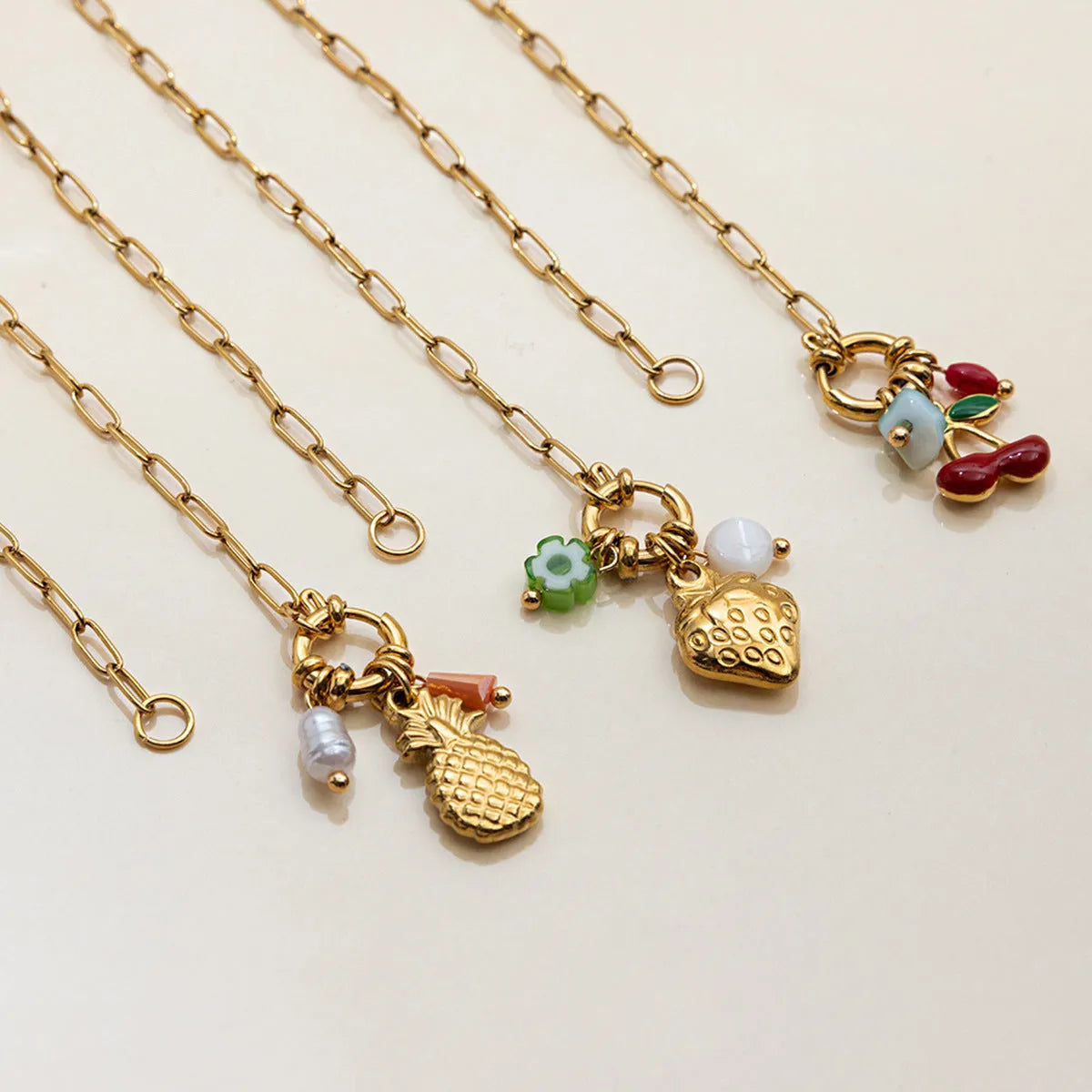 Stainless steel clavicle chain with geometric strawberry-shaped titanium steel pendant in non-fading finish